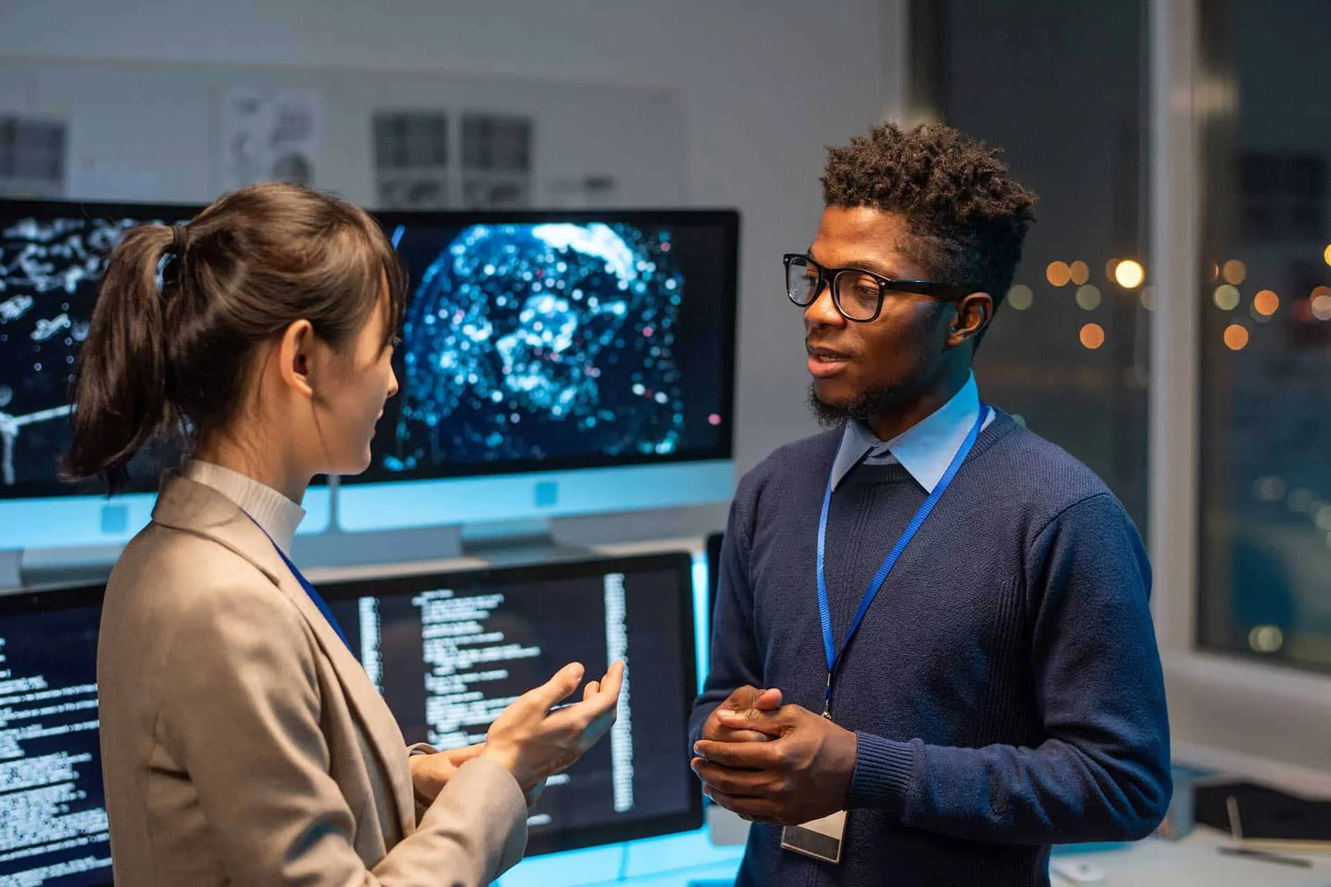 Advanced data analytics and cybersecurity experts collaborating in a high-tech office environment, showcasing innovative IT solutions and digital transformation strategies.