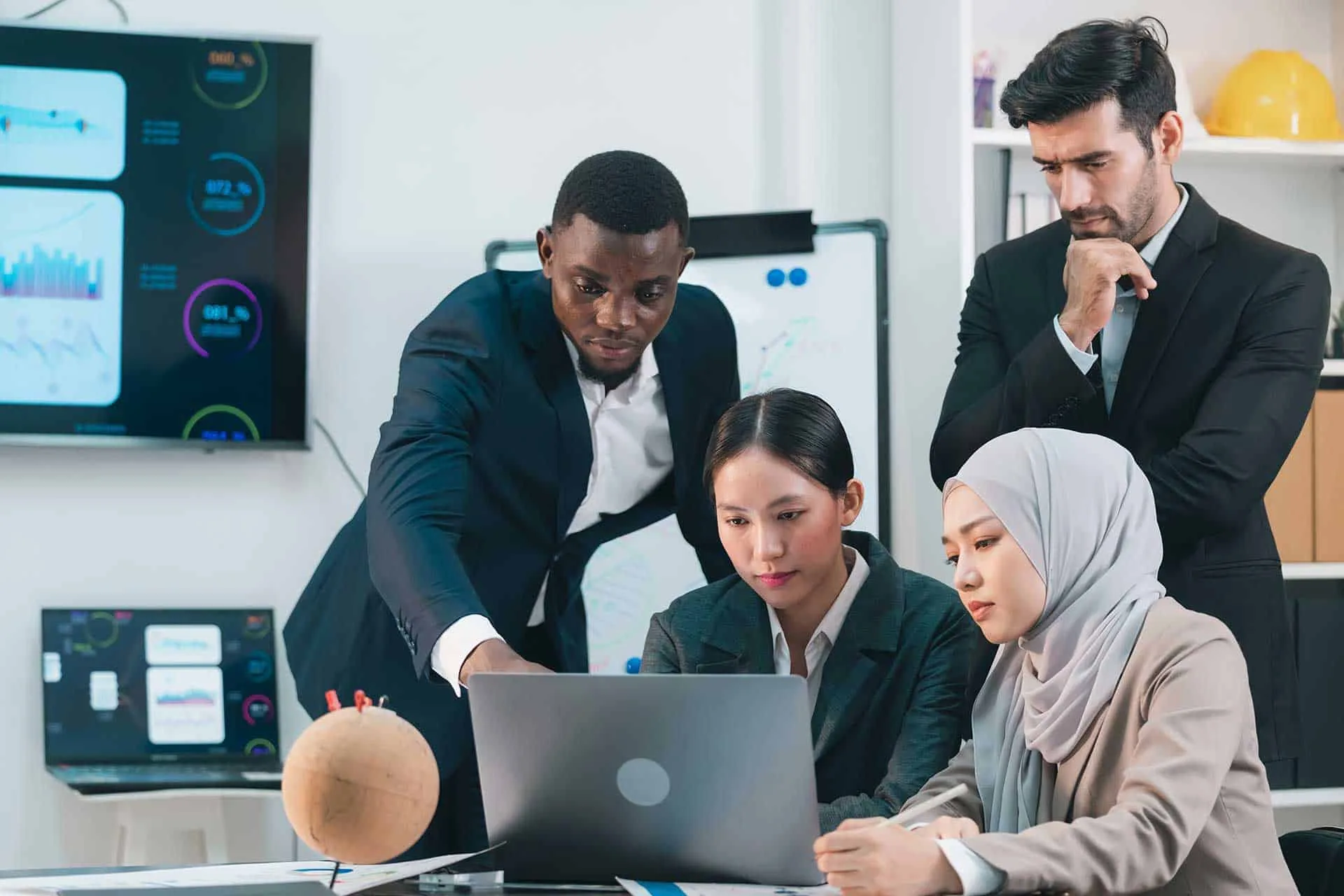 Innovation-driven team collaboration in a high-tech office environment with data analytics and digital tools for business growth.